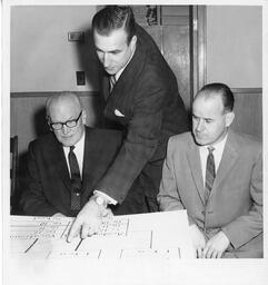 Gordon Campbell Showing Dean Chant and Jim Gray a Chart of the College