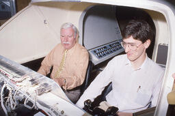 Two Men in a Flight Simulator