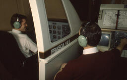 Two Men with a Flight Simulator