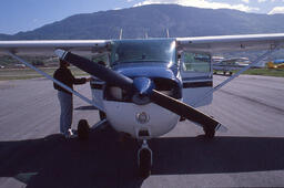 Man Standing Beside Small Airplane